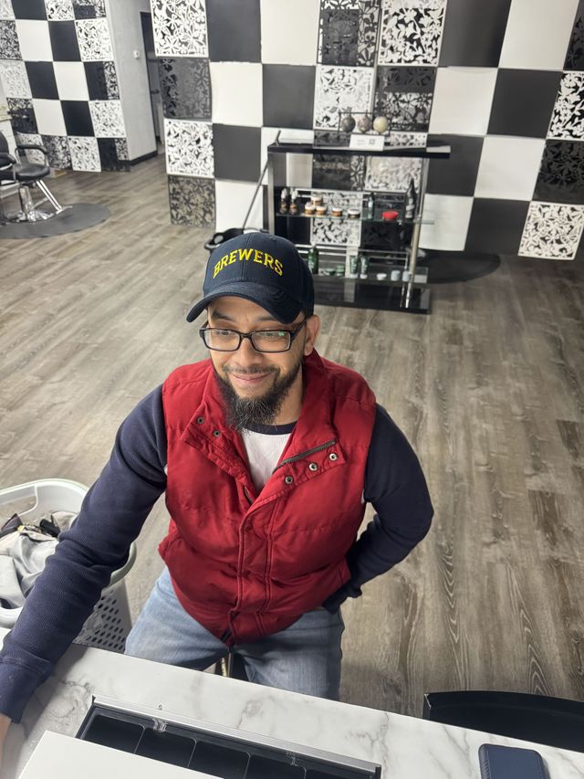 A guest inside International Barbershop